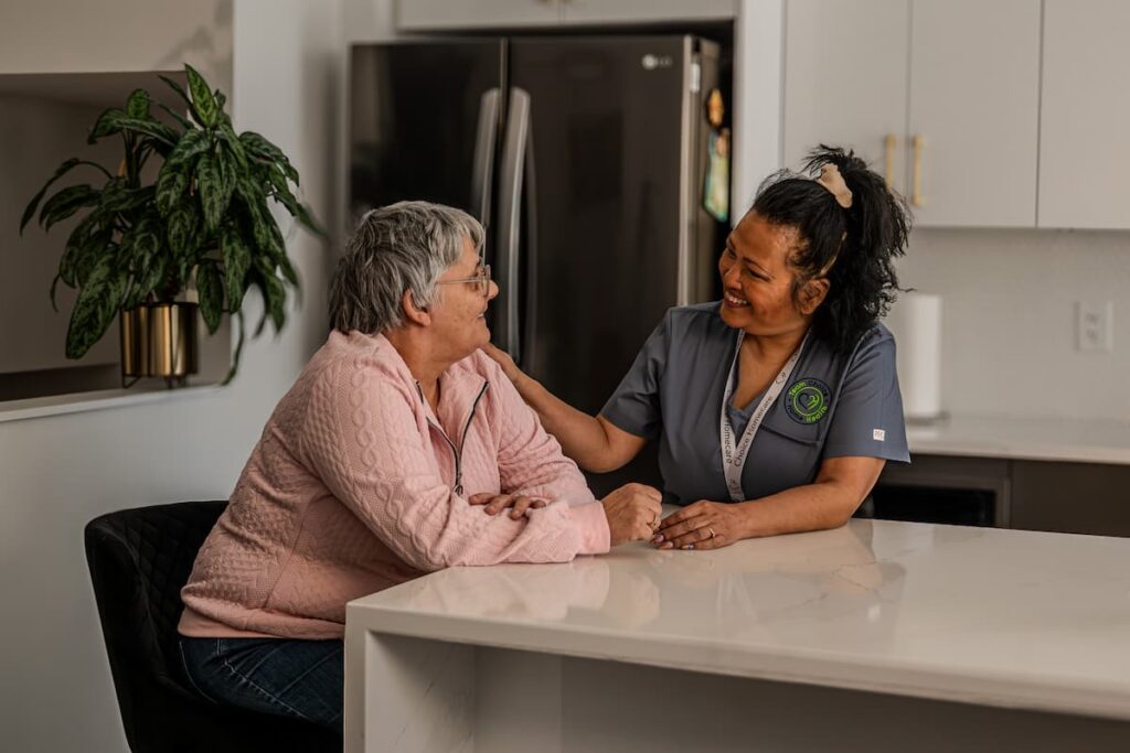 Nurse having a conversation with an elderly woman