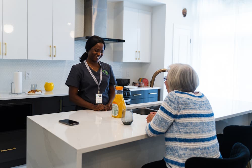 Nurse talking to an elderly woman